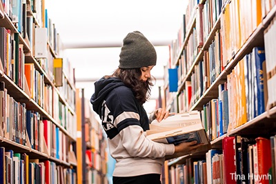 student in library